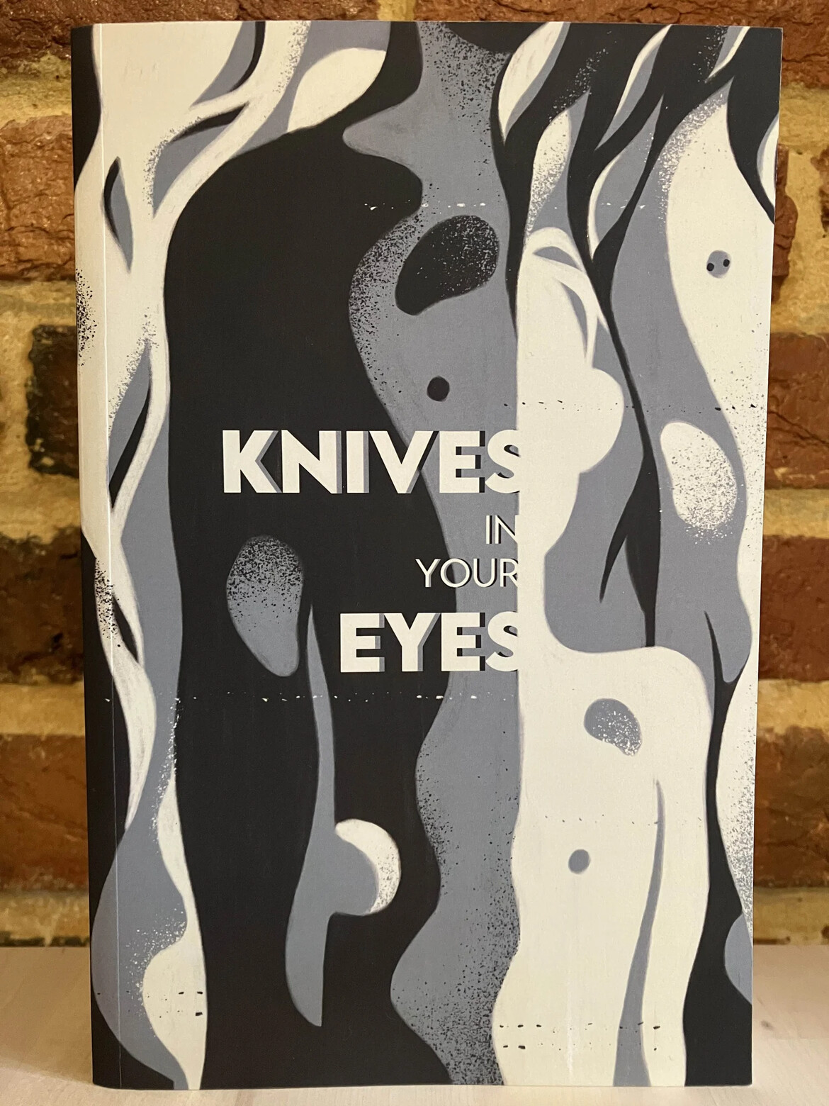 Photograph of the softcover novel KNIVES IN YOUR EYES Photograph of the softcover novel KNIVES IN YOUR EYES