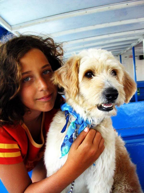 This is Farol with my little sister. He sat next to us at the beach, in an island in the south of Portugal. He followed us around the rest of our vacation and we ended up bringing him home with us.
