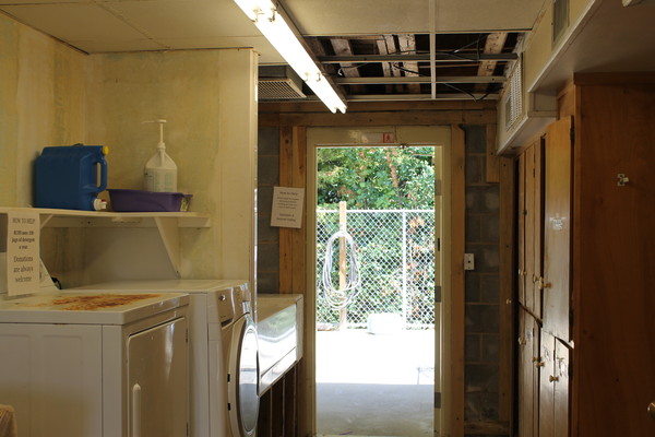 Laundry area that needs to be refinished.
