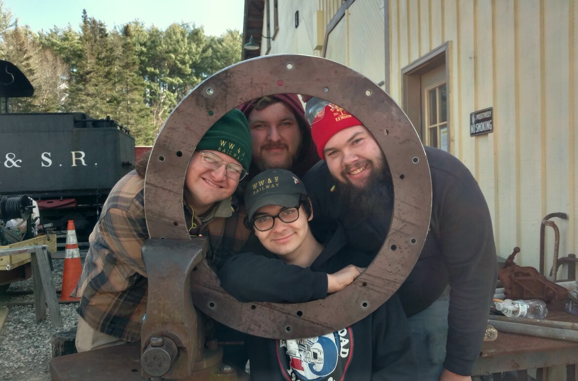 Locomotive 10's new smokebox ring, and part of the restoration crew.