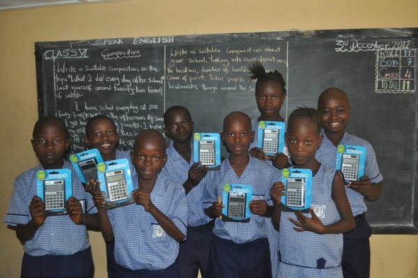 Students displaying their new solar calculators