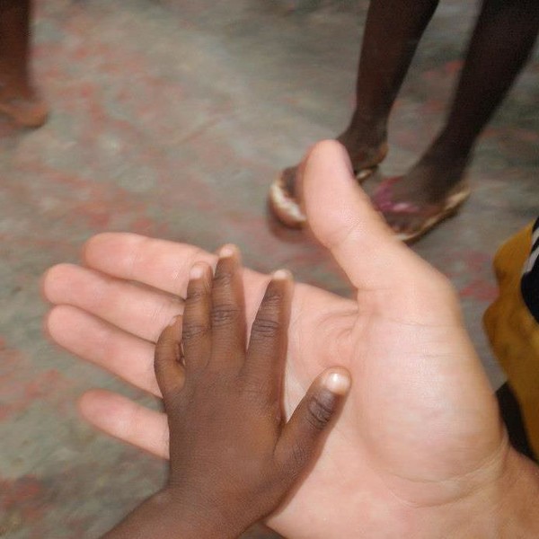 Kevin's hand in hand with Gladin, one of the many orphans he touched not only with his hands but with his heart, love of Christ and Purity.