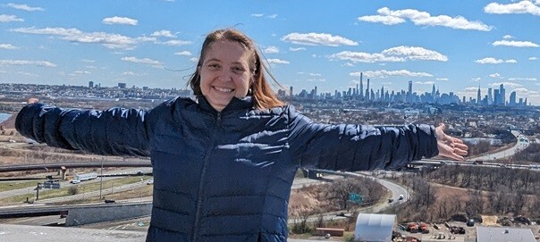 Jen on the roof of Hilton Meadowlands with Manhattan in the background