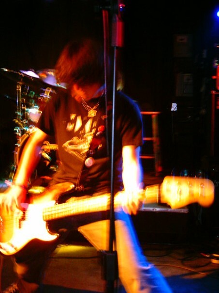 Jacob Burns plays bass in his punk rock band Rock n' Roll for Dummies
