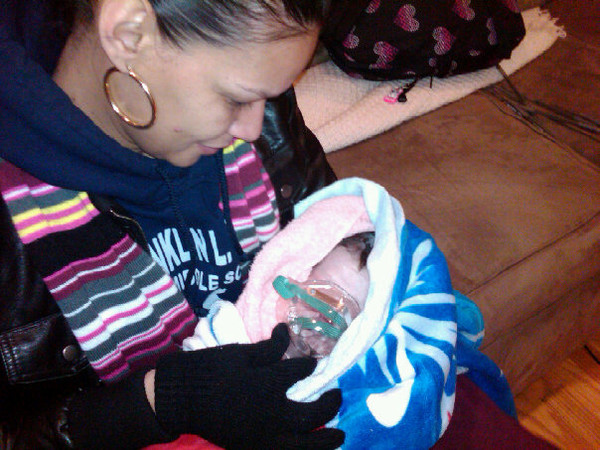 Minutes after Jazi was born and her umbilical cord was cut, she needed some oxygen being held by her Titi Cindy