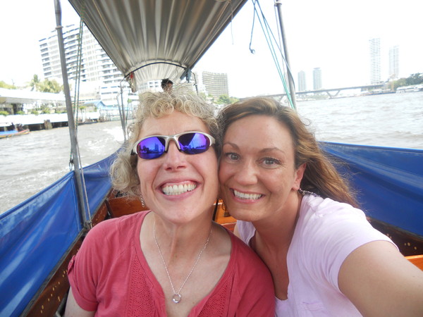 Cathy & Tricia cruising the river in Thailand, May 2013