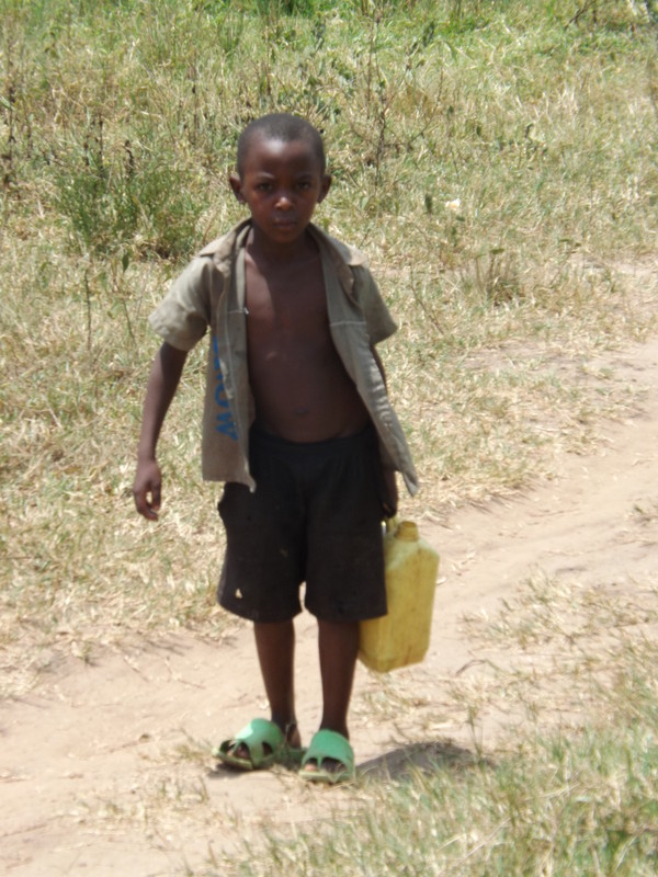 A young boy walks for miles to find drinking water that is not safe or clean.