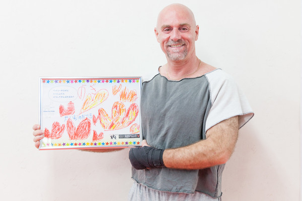 This is me holding up a drawing from a 4 year old girl that has cancer.  She knows that I will be fighting for her.