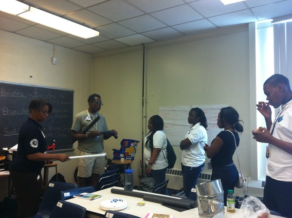 Students Training and Reviewing Materials for Weatherization Home Visits for the Summer