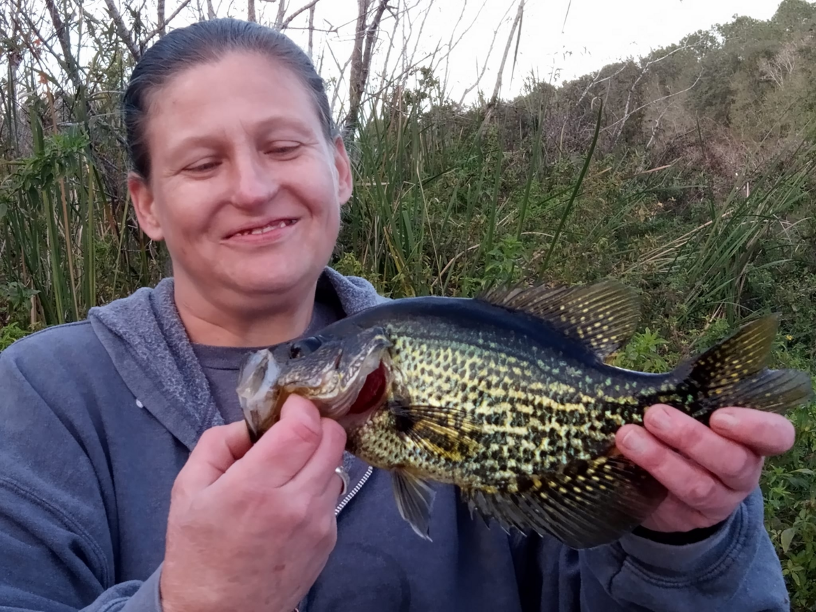Crystal holding a Speckled Perch that took the bait as soon as it hit the water