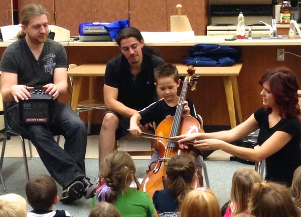 Cello Fury in AC Valley Small workshops - student trying the cello