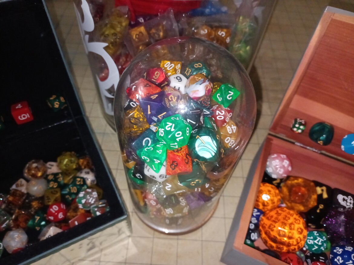 Oh dag, I realized I might have a dice problem. I went to gather up dice to take this picture, and this is just what we had on our dining room table. It's not even game night tonight. Send help. Or pictures of your dice collection.