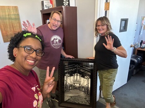 *Pictured: Reverend Stephen Govett, Laura (church admin.), and Chantal Chandler (Me) gifting the church the photo I took of the sanctuary. circa. September 2024