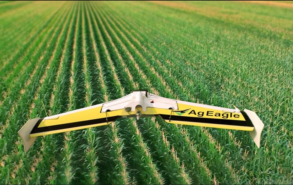 This is a photograph of a drone cultivating a rice farm in the developing world. Below is a link describing rice planting in Louisiana