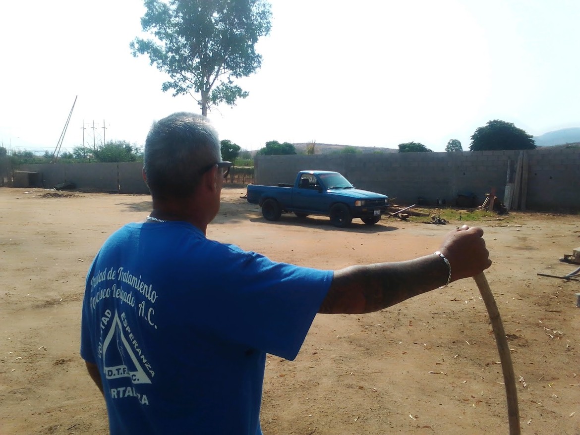 Padrino Juan Jose overlooks the space where we will construct the new women's facility.