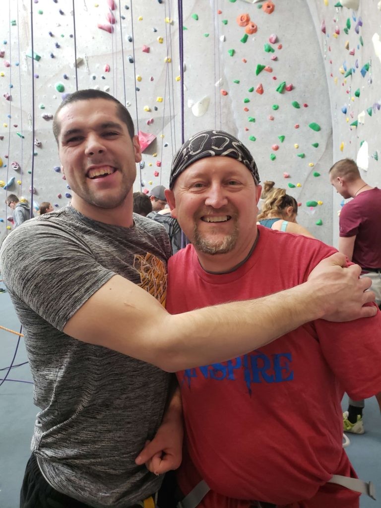 Train to Inspire participant with rock climbing instructor