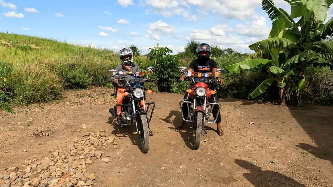 The first two motorcycles arrive in Rudungai.