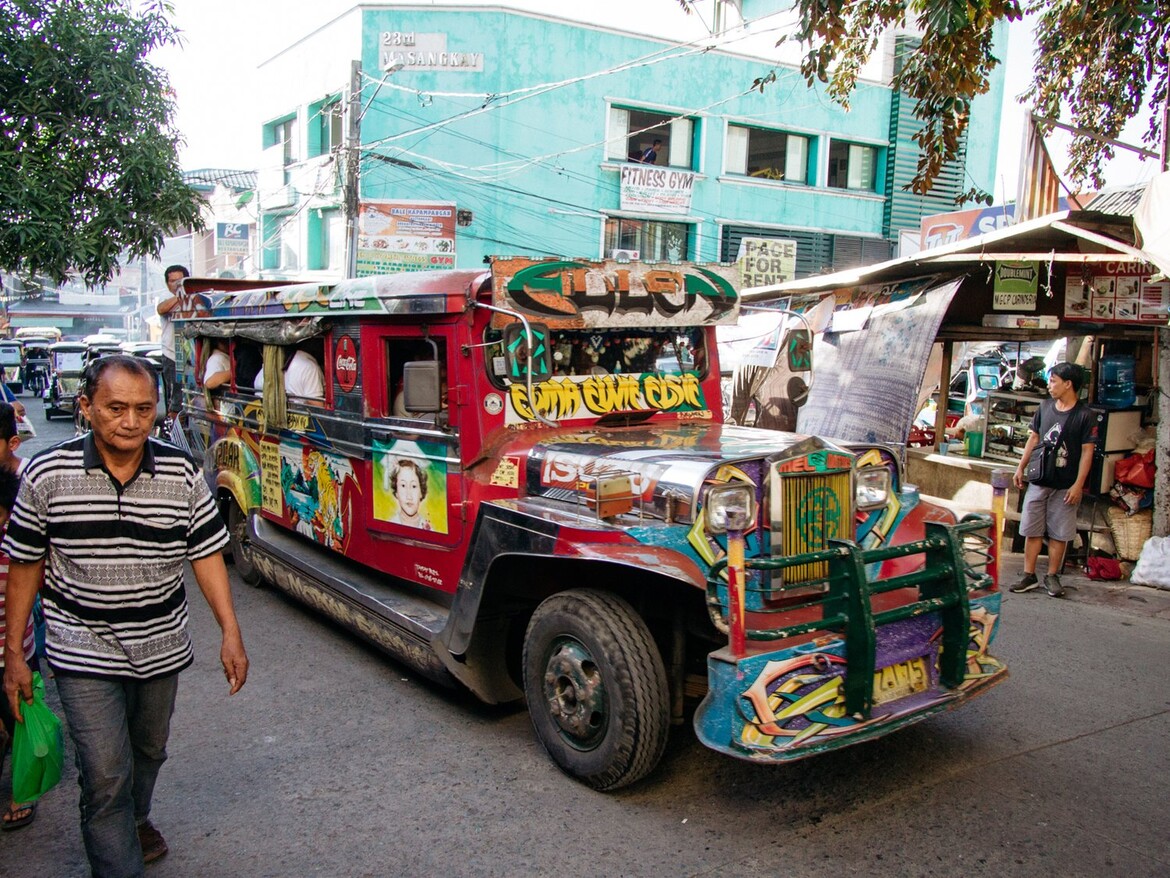 A jeepney travels through the streets of the Philippines. Image courtesy Culture Trip