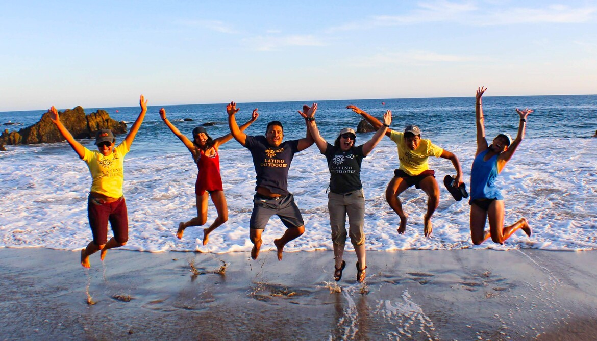 Group of LO leaders at Malibu Beach jumping in the air