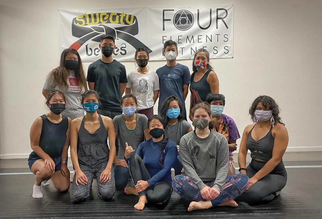 Students post with Tuff Love instructors after a self-defense class at Four Elements Fitness. This class was sponsored by Compassion in Oakland.