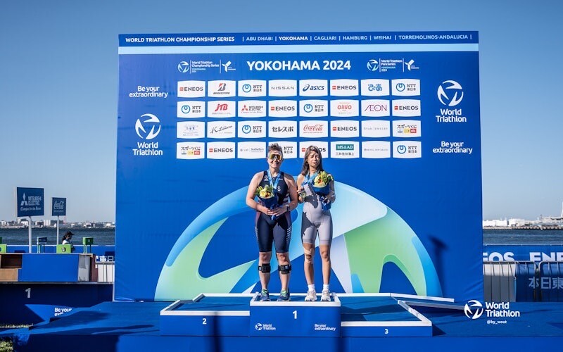 Rachel stands on the finishers podium in Yokohama
