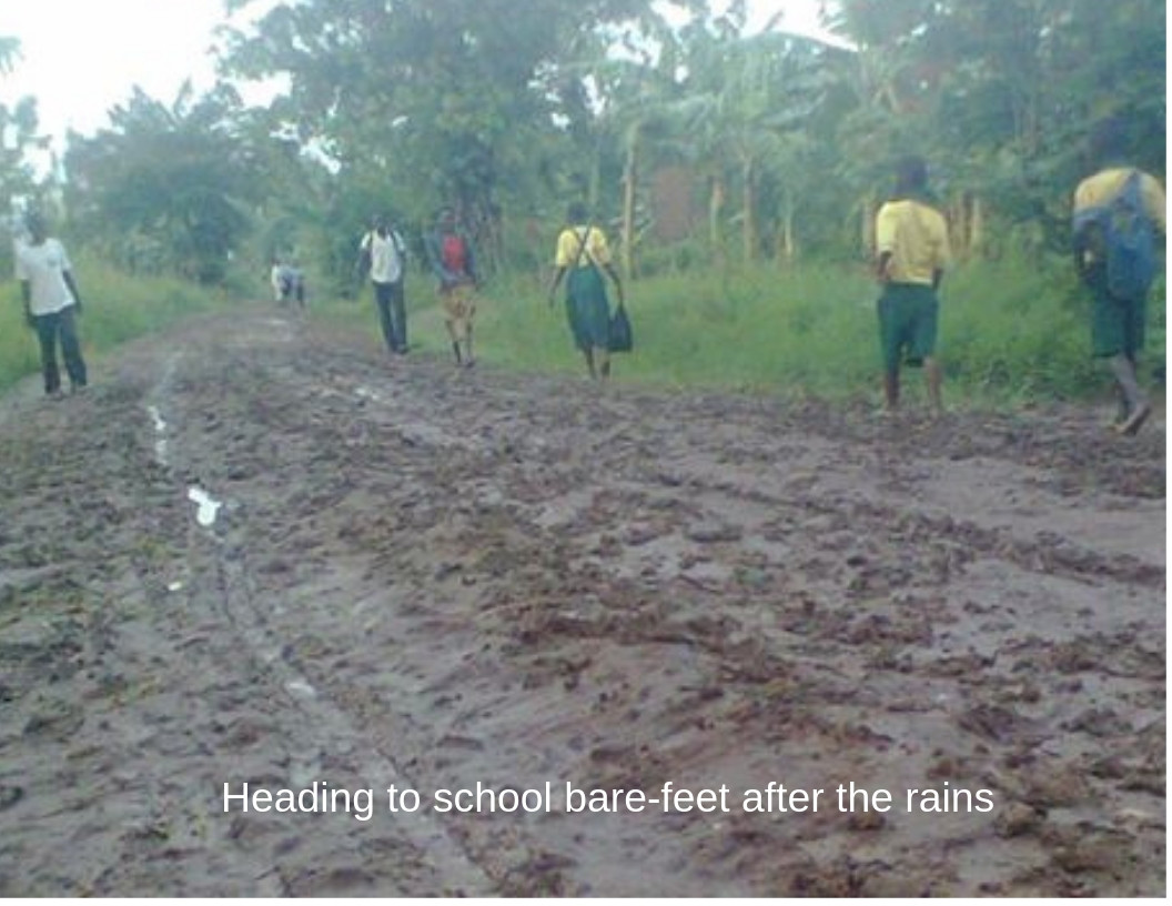 children walking bare-feet on a bad muddy road-rich alt text