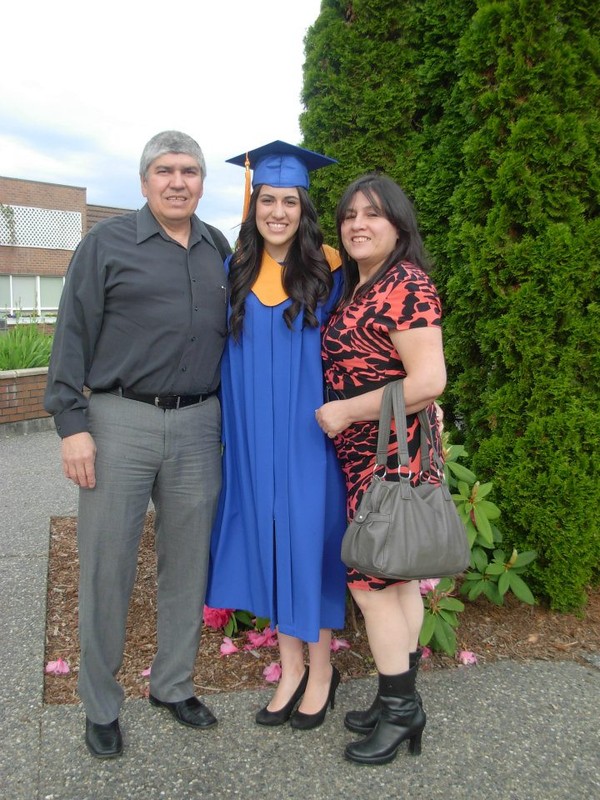 Daniela and her parents at graduation