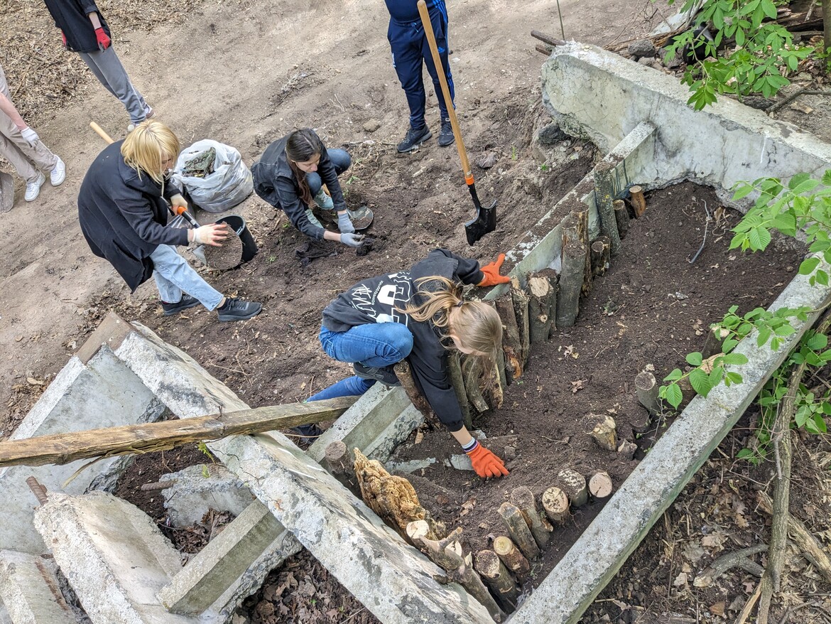 Volunteers cleaning and planting at our Therapy Garden