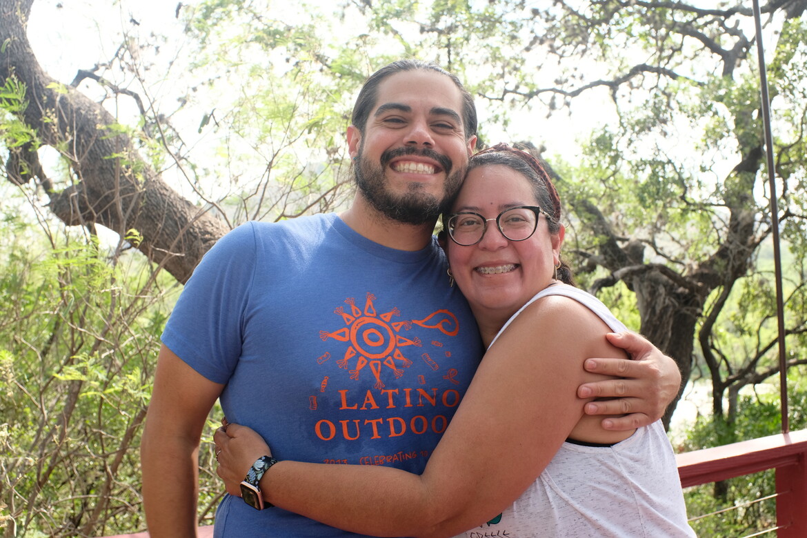 two volunteers hugging