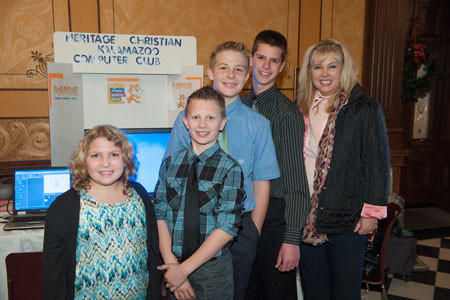 Members of the Heritage After-school Computer Club at the capital building in Lansing with State Senator Tonya Schuitemaker.