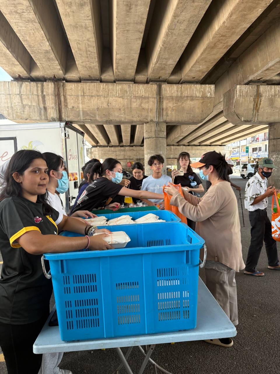 Distributing food packs to underprivileged people