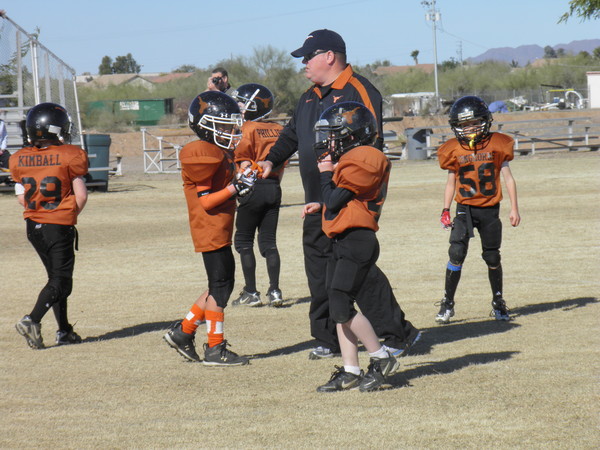 CJ volunteered as a coach for Youth Football for several years