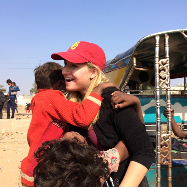 Katherine being greeted by some of the children she worked with in India