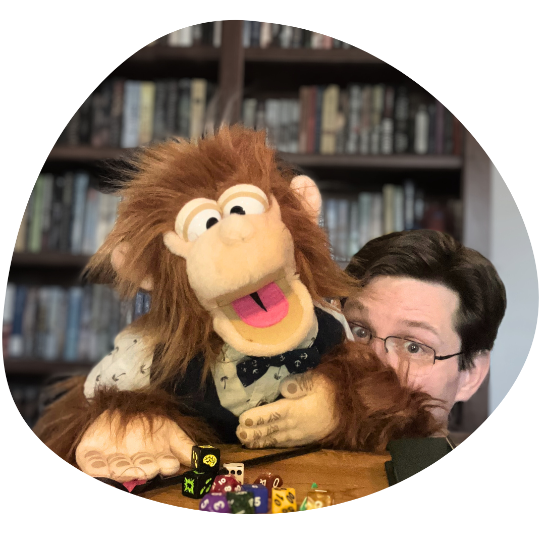 Headshot of the author and a puppet