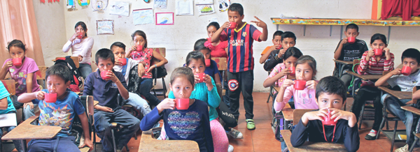 4th graders drinking milk for snack at The School of Hope, April 2017.